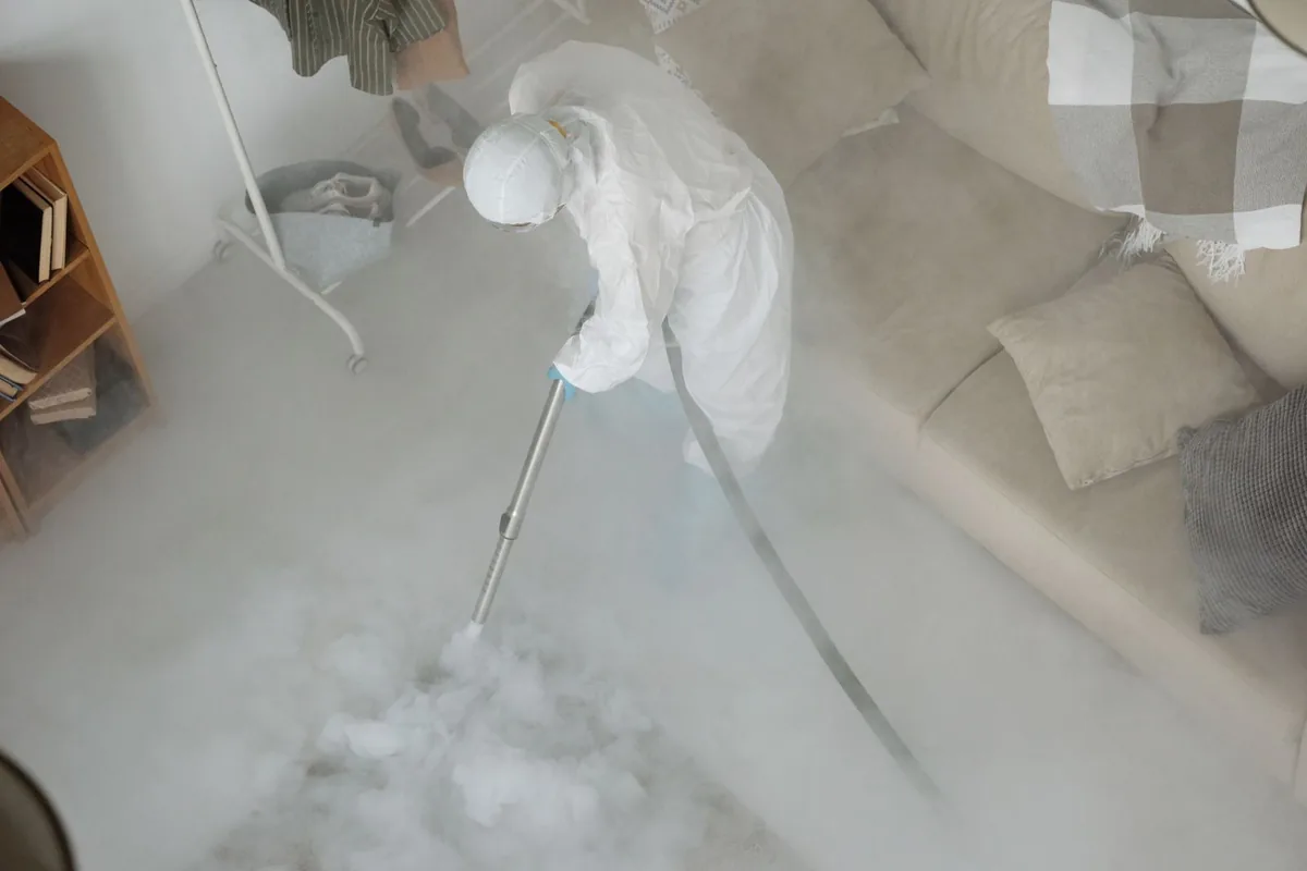 Biohazard cleanup technician in protective equipment, Monaca, PA